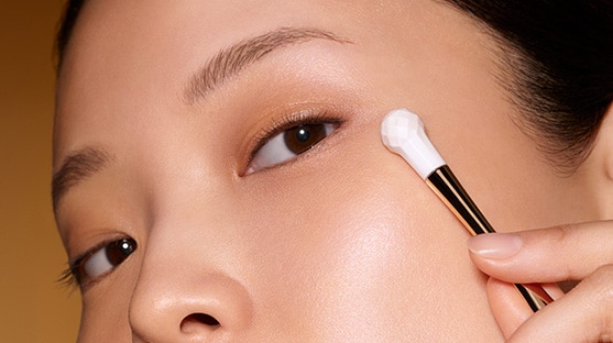 photo of woman applying re nutriv age reversal eye creme age reversal technique